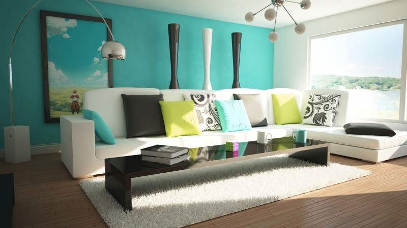 Canto de quarto com cômoda e tons de turquesa e verde